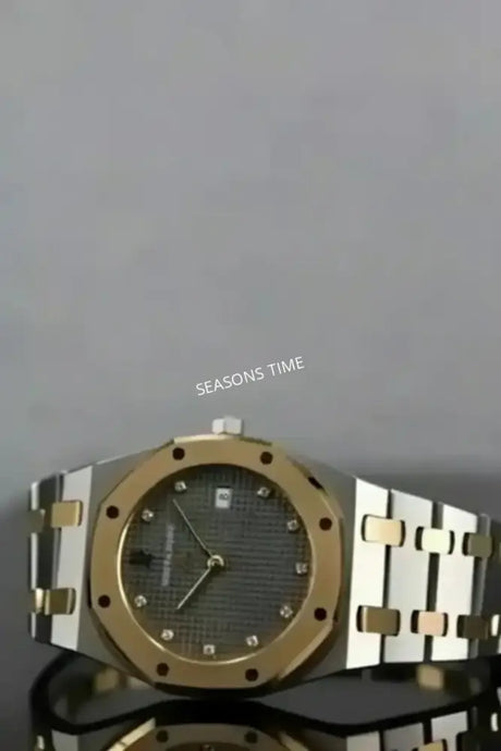 Two-tone stainless steel and gold watch with a diamond-studded dial.